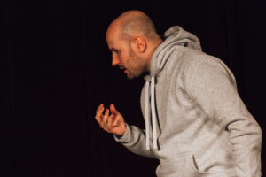 Santiago Arca Henon performing as "This is Our Youth" (1996), by Kenneth Lonergan. It is a play about becoming an adult in a big American city where many dangers and temptations lurk for innocence. The story of two friends, stolen money, drugs, loneliness, bad parents, and a girl. In the scene, Warren visits Dennis (me). He brings not only weed but also a lot of money. This is the beginning of troubles and complications. Play performed as part of the Weekend Acting School for Adults, of the Akademia Sztuki i Kultury. February 2024.