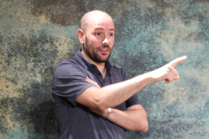 Santiago Arca Henon performing improvisation in English with Jest Set, an improv group, at bar Południk Zero, in Warsaw.